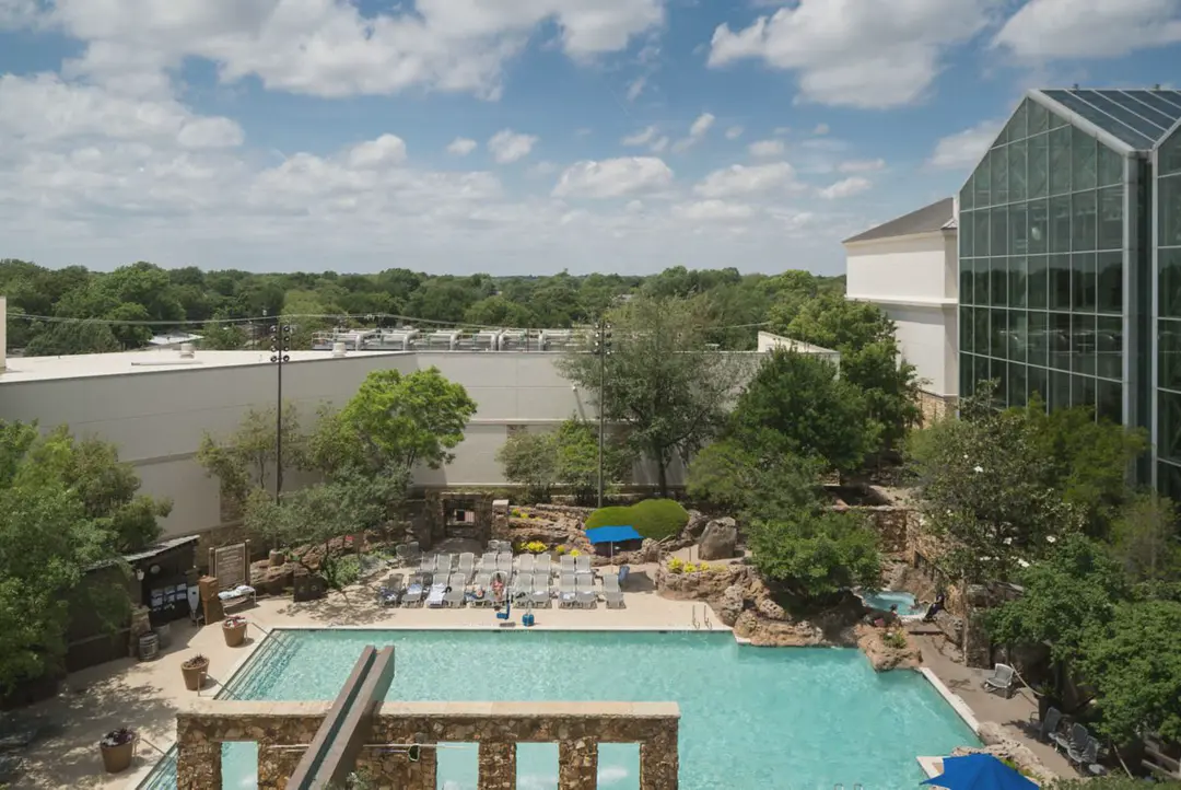 The outdoor resort pool and loungers seen from above